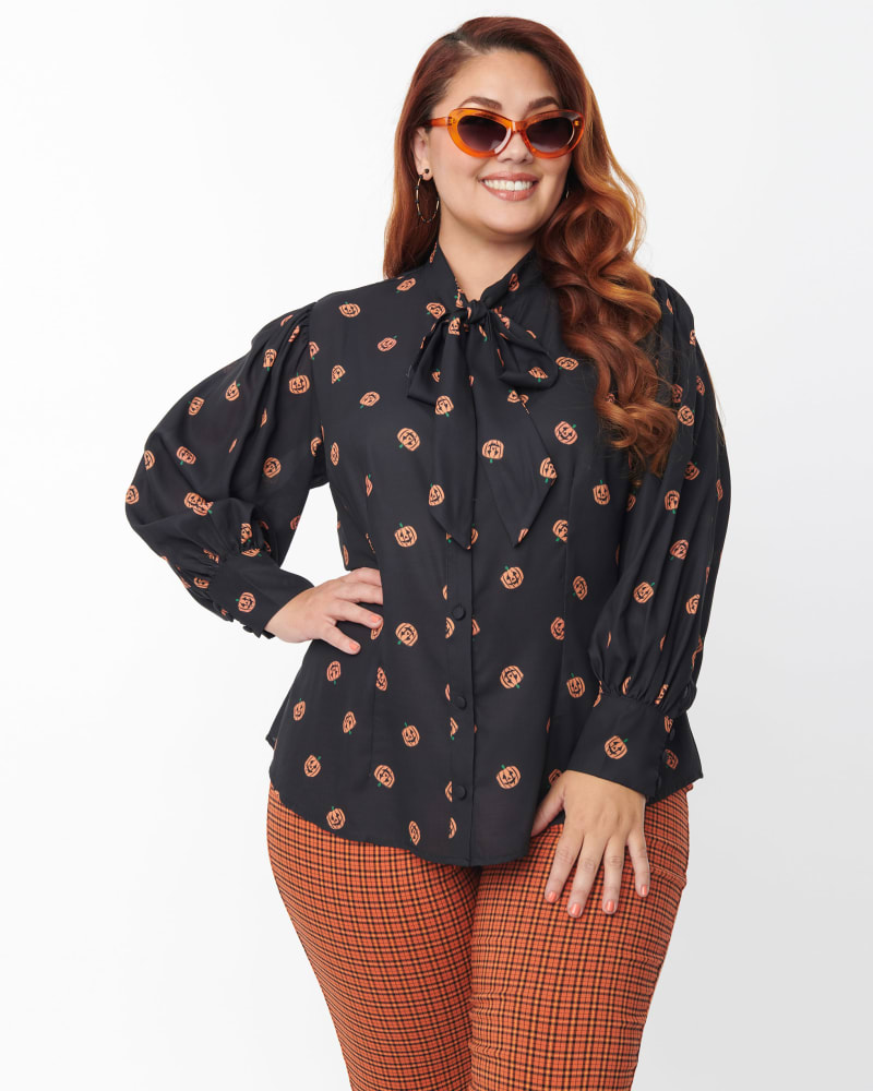 Front of a model wearing a size 3X Unique Vintage Plus Size 1950s Black & Pumpkin Print Gwen Blouse in Black by Unique Vintage. | dia_product_style_image_id:299007